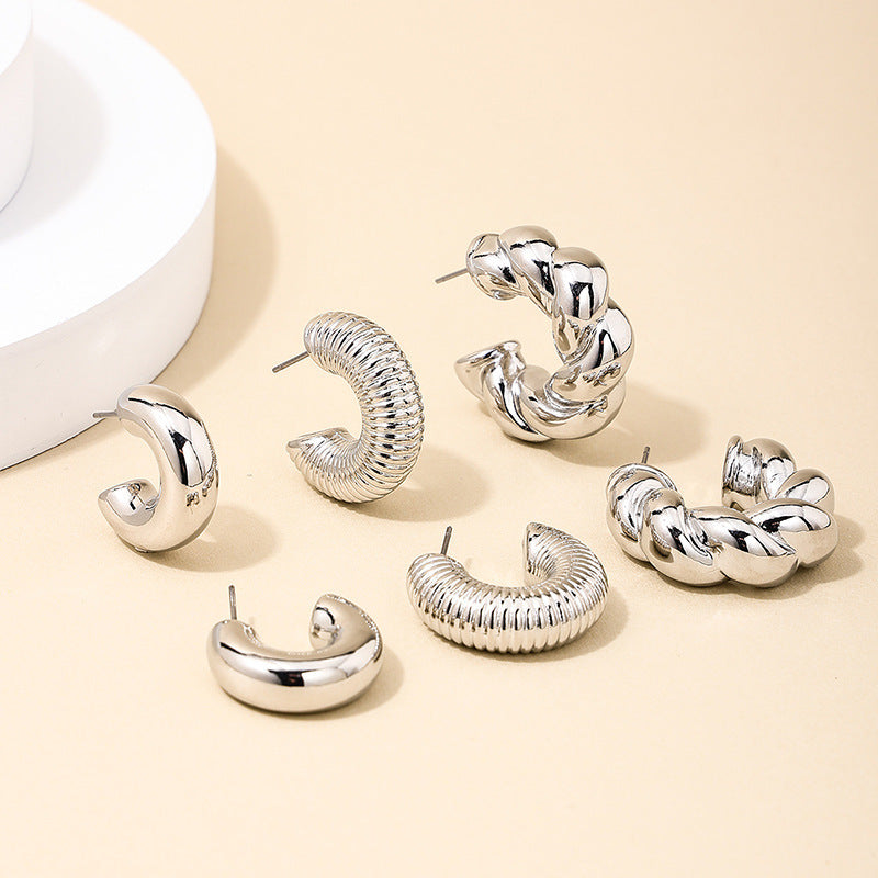 European and American fashion simple twist earrings ladies suit smooth light luxury design sense square face earrings jewelry wholesale