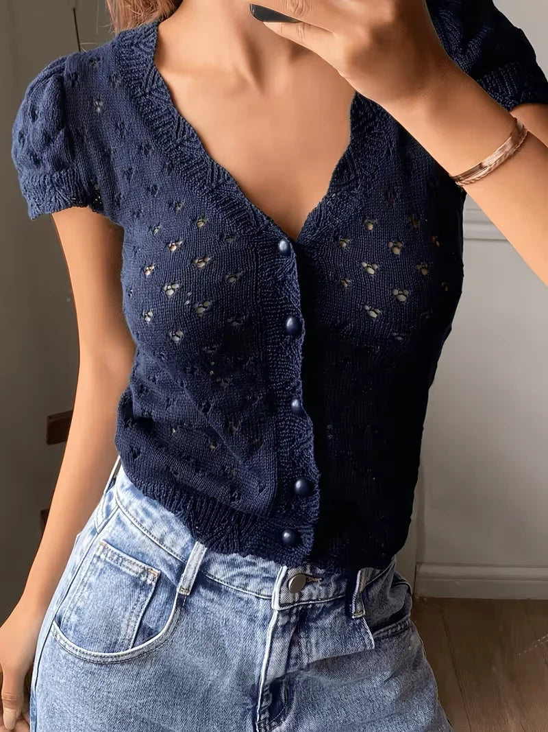 V-neck hollow-out short-sleeved knitted cardigan with single-breasted design, featuring a French vintage and gentle style short