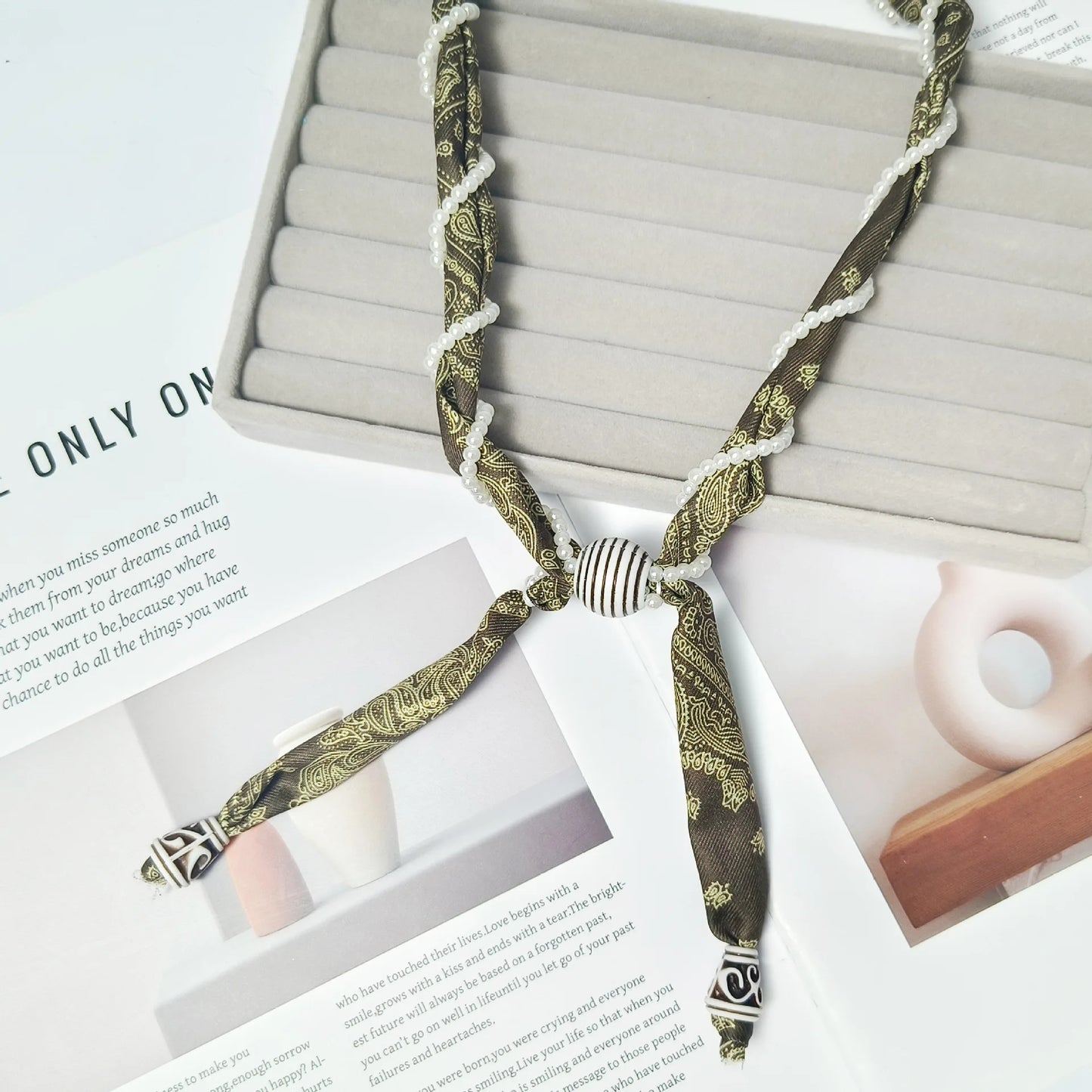 Cashew flower wrapped pearl scarf neck necklace for female artist, unique and beautiful hanging neck accessory, long sweater cha
