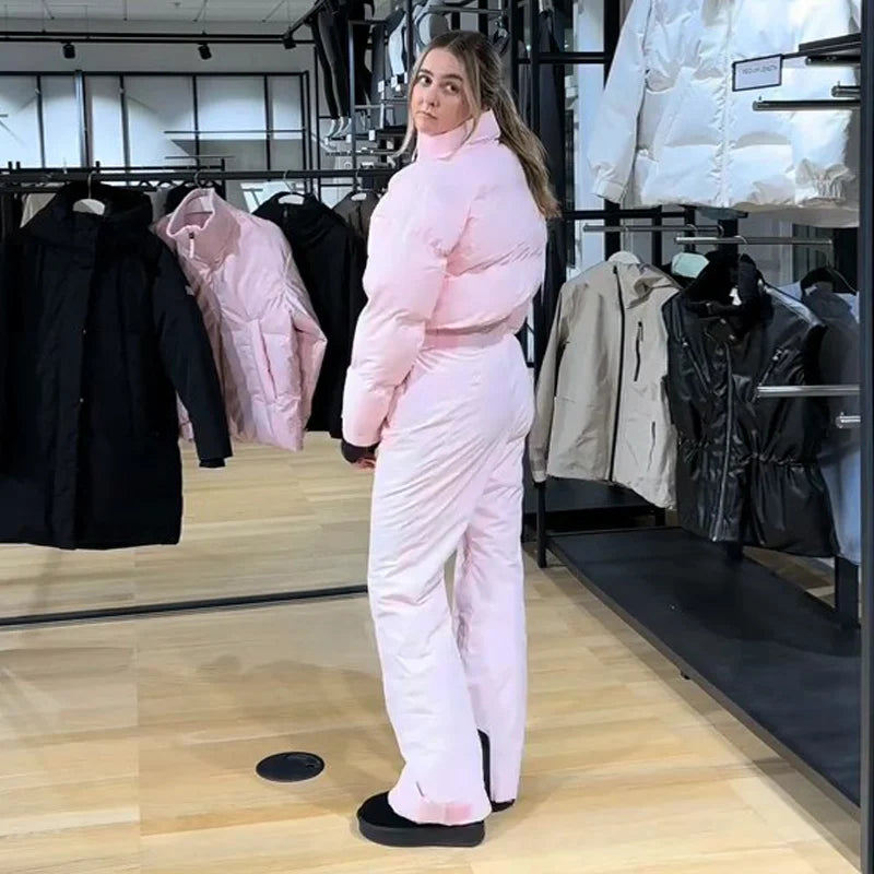 Fashion Pink Faux Fur Patchwork Hood Ski Jumpsuit Women Stand Collar Zipper Slim Pocket One Piece Suit 2026 Winter Lady Skiwears