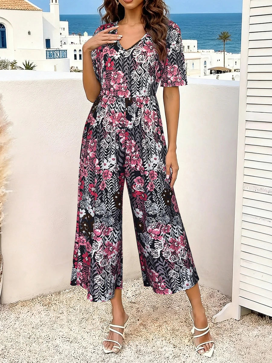 Women's Pink Floral Print Short Sleeve Jumpsuit, Summer Casual V Neck Elastic Waist Wide Leg Romper With Side Pockets