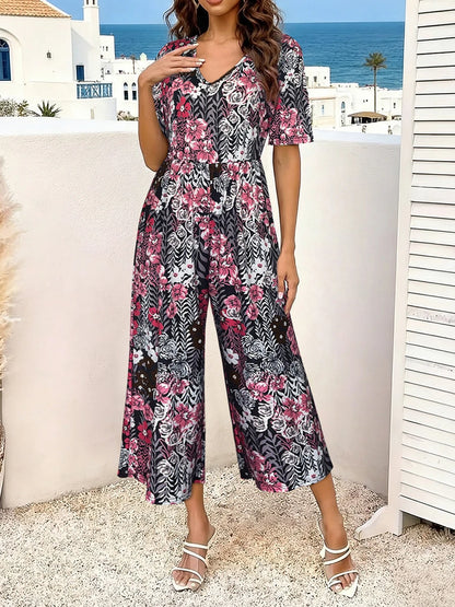 Women's Pink Floral Print Short Sleeve Jumpsuit, Summer Casual V Neck Elastic Waist Wide Leg Romper With Side Pockets