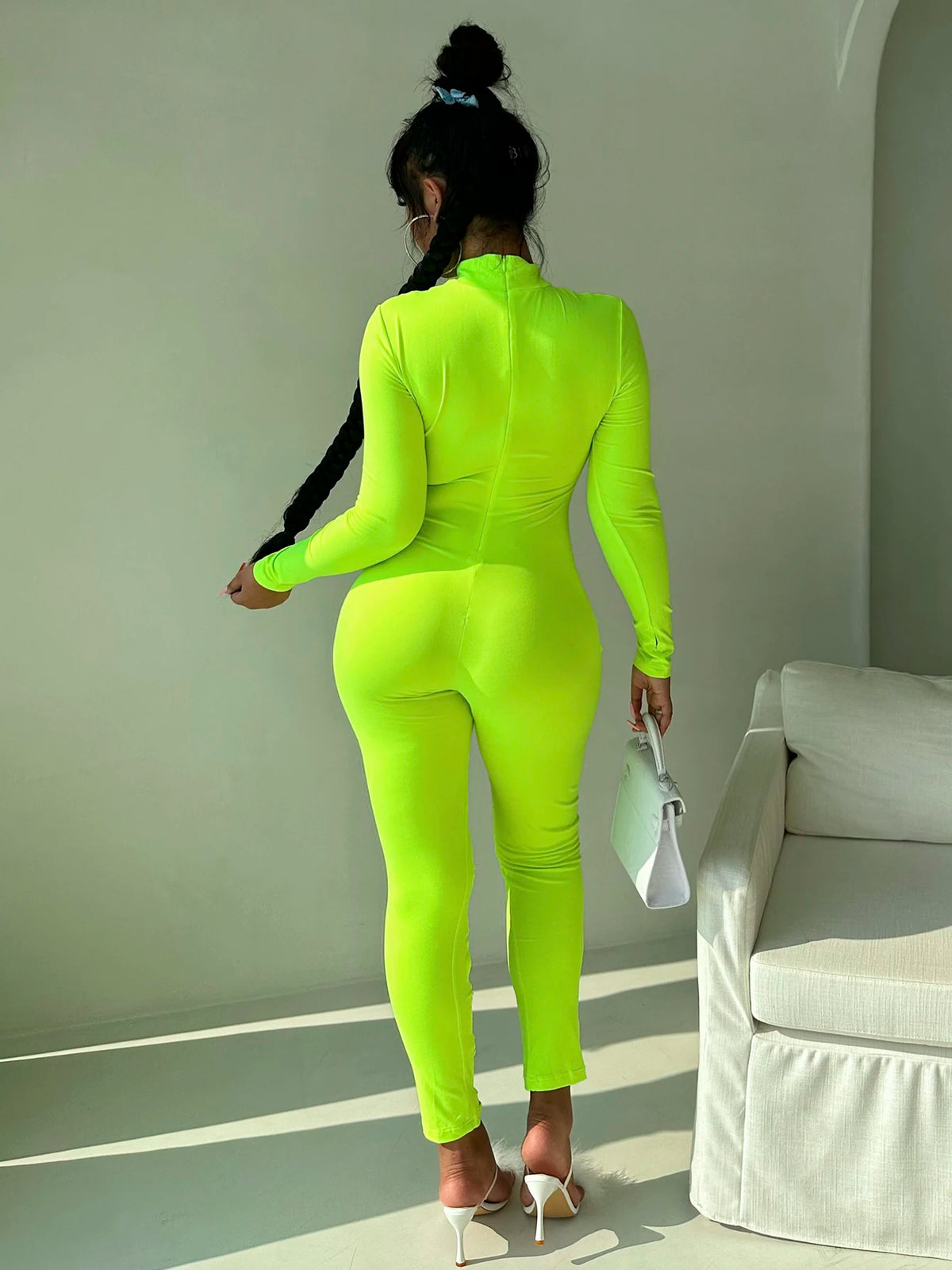 Women's stand up collar tight solid color jumpsuit with metal circle decoration long sleeved all-in-one pants, fitness leggings