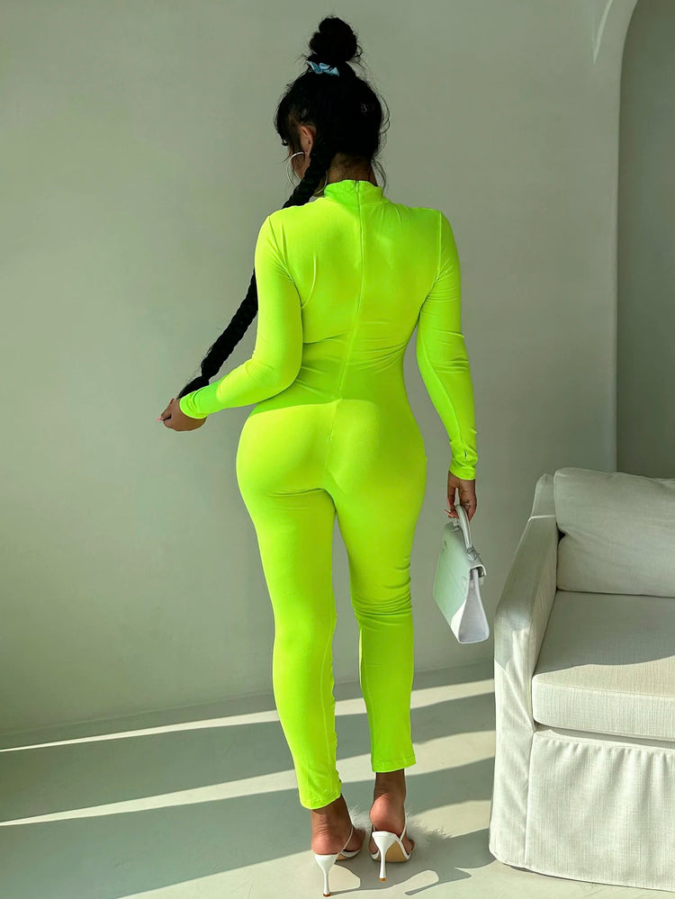 Women's stand up collar tight solid color jumpsuit with metal circle decoration long sleeved all-in-one pants, fitness leggings
