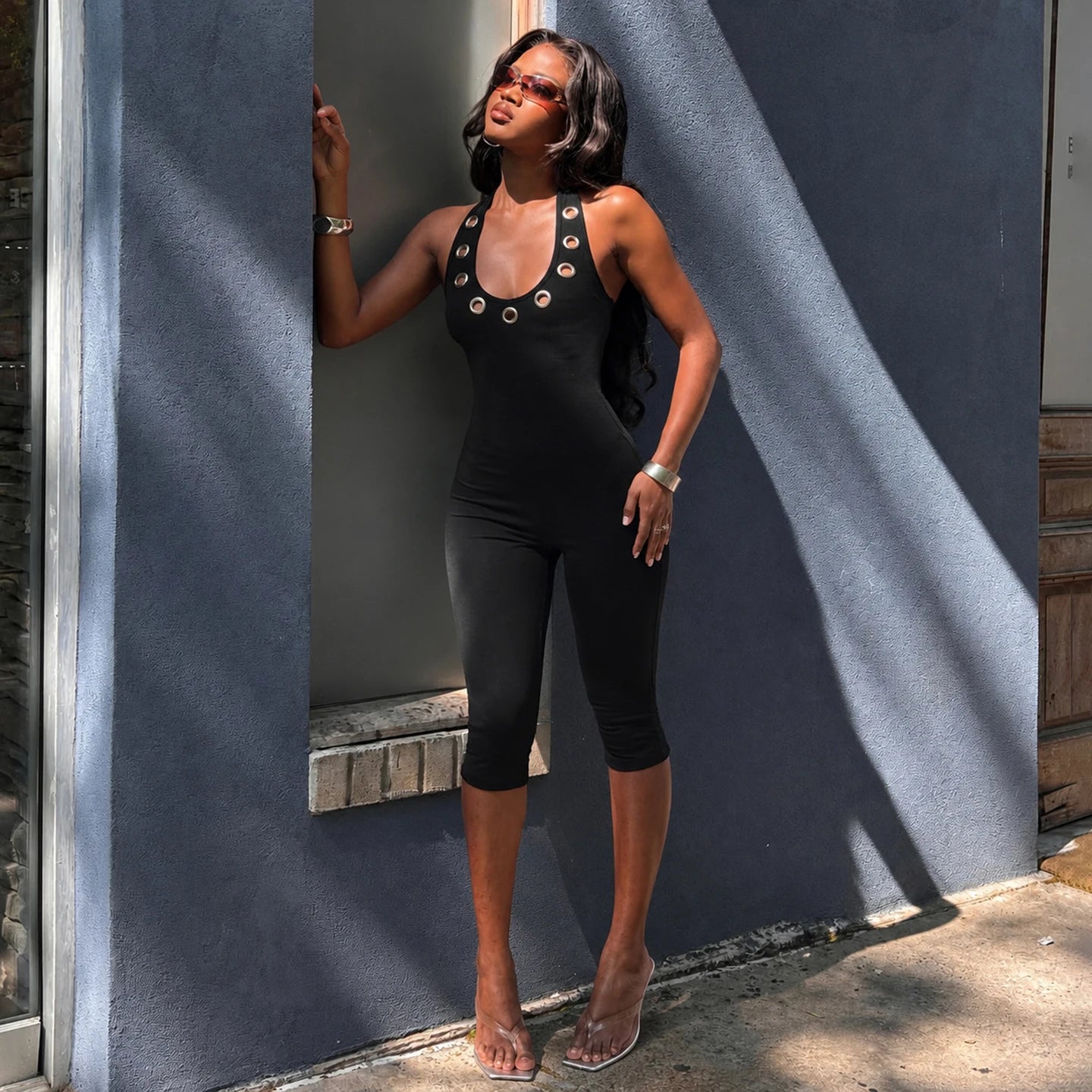 Women's Sleek Black Halter Jumpsuits With Eyelet Detailing Form-Fitting Capri Length Design Chic And Minimalist Summer Outfits
