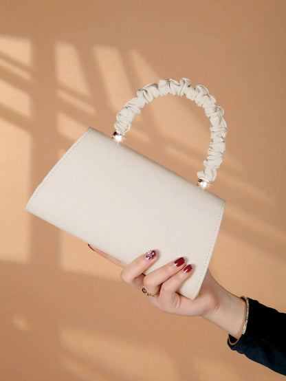 Elegant light luxury solid color women's handbag, fashionable and romantic banquet clutch, suitable for women's daily use.