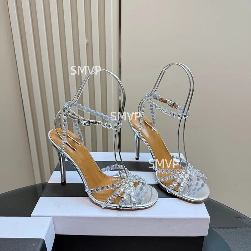 Women Crystal Rhinestone High Heel Sandals 2026 Summer New Toe Ankle Strap Thin Heels Transparent Silver Party Wedding Shoes
