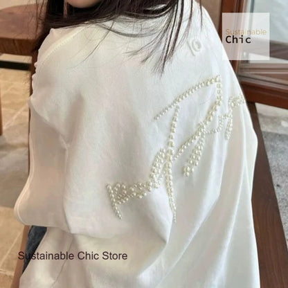 Korean version of fashion stereoscopic Pearl senior loose round neck T-shirt women's summer fashion and leisure niche design top