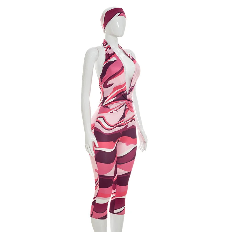 Two piece set of tight fitting seven part jumpsuit with deep V-neck print and headband