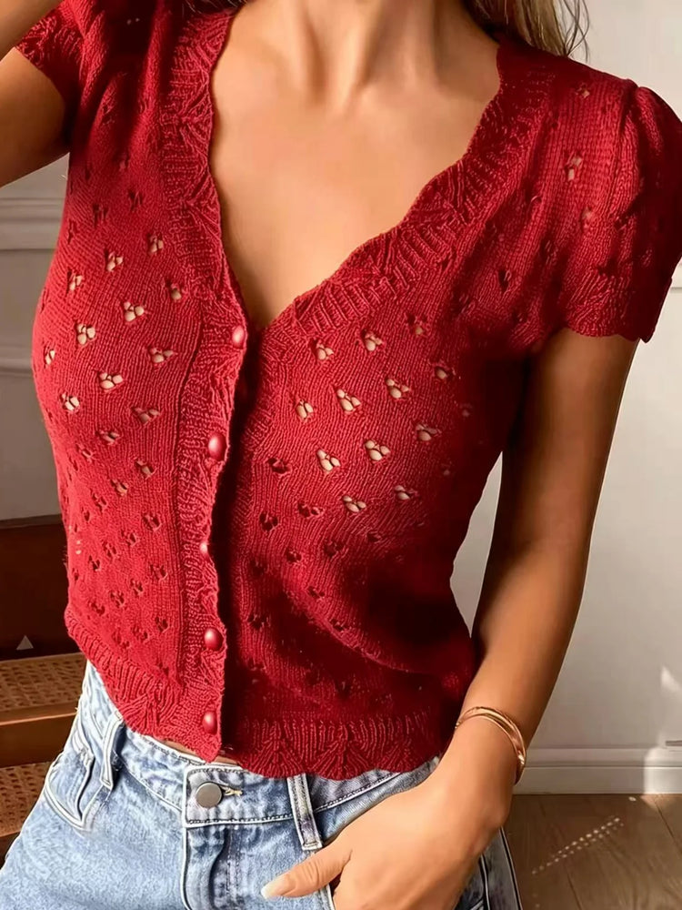 V-neck hollow-out short-sleeved knitted cardigan with single-breasted design, featuring a French vintage and gentle style short