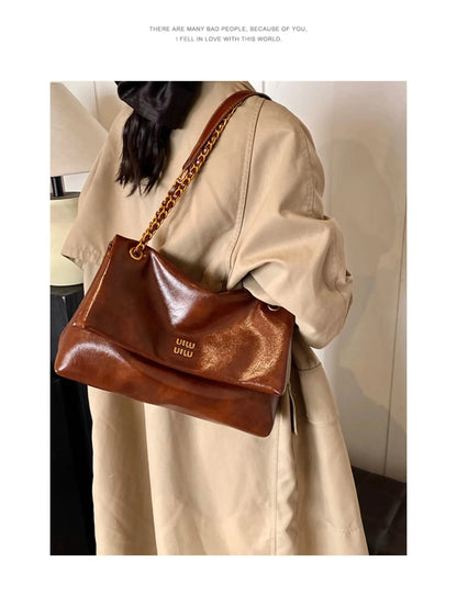 High-quality designer large-capacity underarm tote bag female 2026 new wild light luxury high-end commuter chain messenger bag