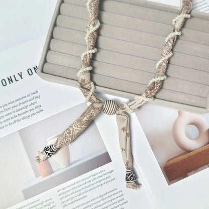Cashew flower wrapped pearl scarf neck necklace for female artist, unique and beautiful hanging neck accessory, long sweater cha