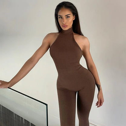 Hugcitar Ribbed Halter Backless Solid Button Sexy Bodycon Skinny Jumpsuit Summer Women Fashion Vacation Romper Streetwear Club