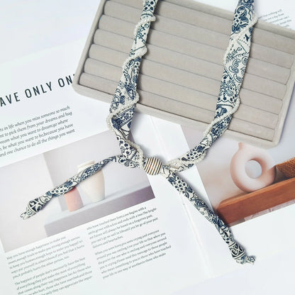 Cashew flower wrapped pearl scarf neck necklace for female artist, unique and beautiful hanging neck accessory, long sweater cha