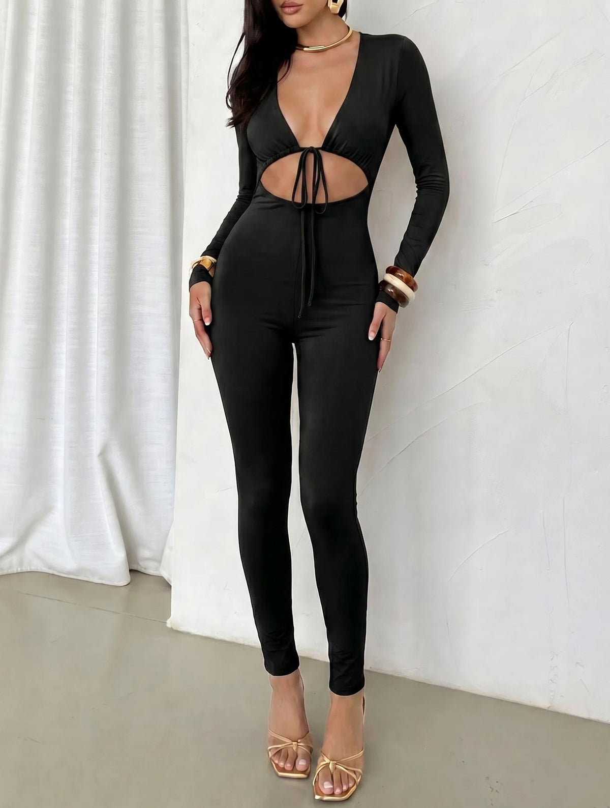 Women's solid color sexy exposed navel lace up hollow long sleeved slim fit jumpsuit