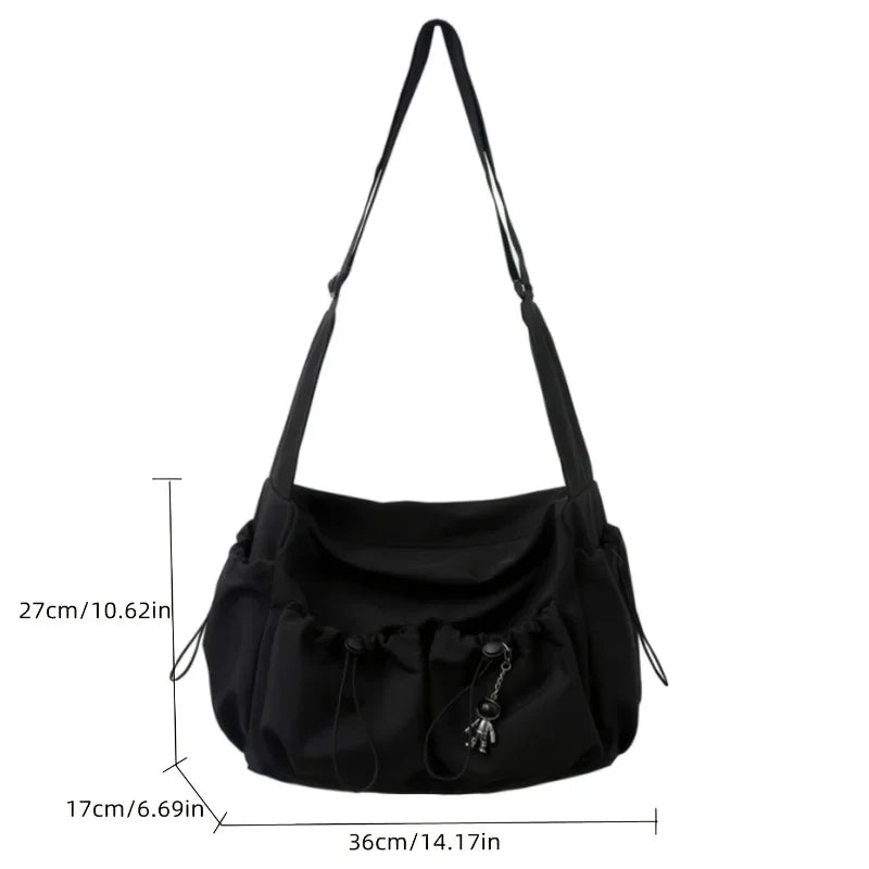 Fashionable Crossbody Bag with Drawstring Accent - Spacious & Secure Zipper Closure - Includes Stylish Bag Charm