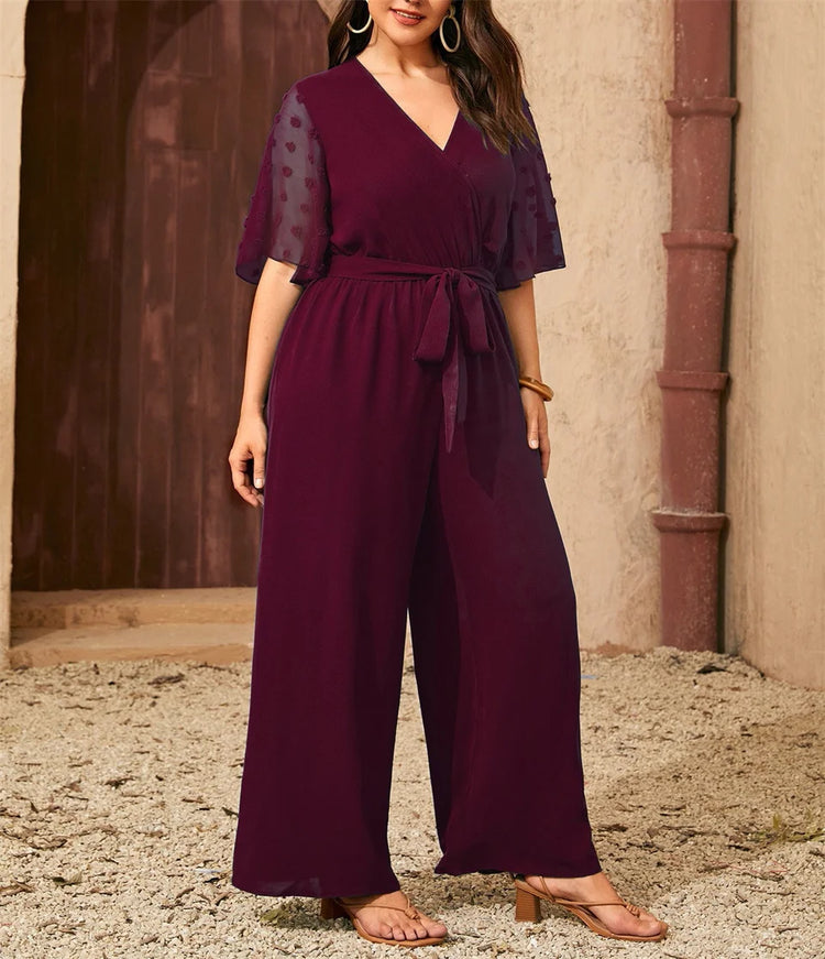 GIBSIE Plus Size Swiss Dot Flounce Sleeve Belted Jumpsuit Women Summer V-neck Elegant Vacation Solid Color Wide Leg Jumpsuits