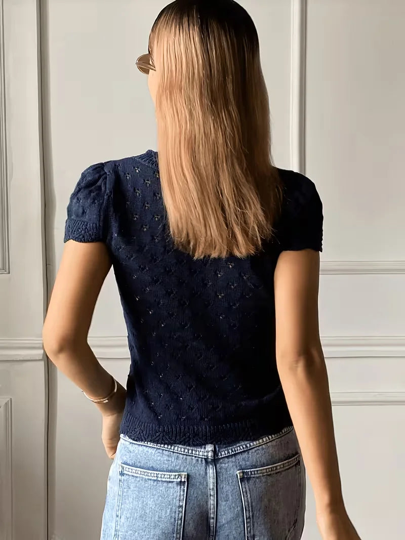 V-neck hollow-out short-sleeved knitted cardigan with single-breasted design, featuring a French vintage and gentle style short