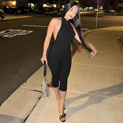 Hugcitar Ribbed Halter Backless Solid Button Sexy Bodycon Skinny Jumpsuit Summer Women Fashion Vacation Romper Streetwear Club