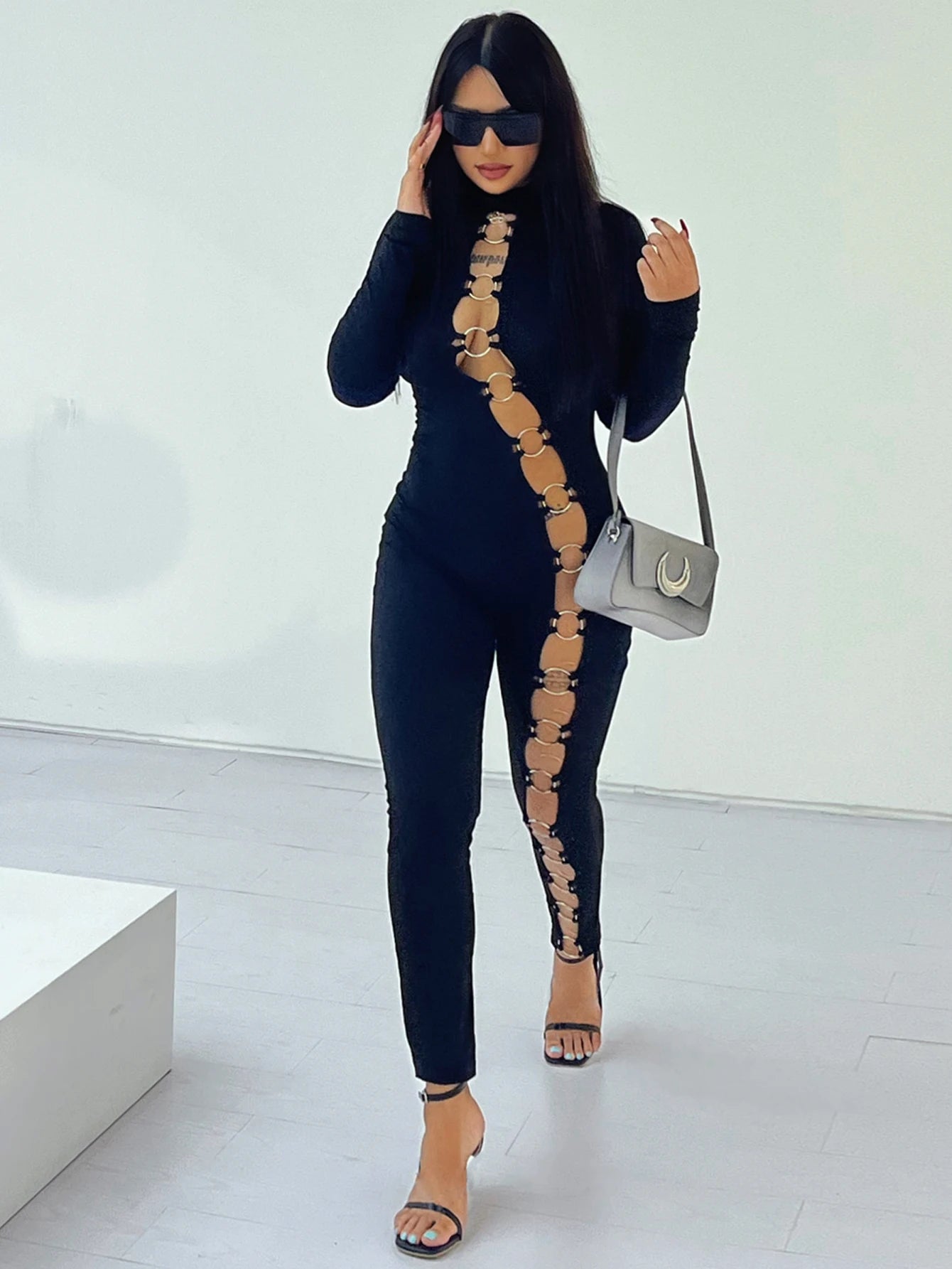 Women's stand up collar tight solid color jumpsuit with metal circle decoration long sleeved all-in-one pants, fitness leggings