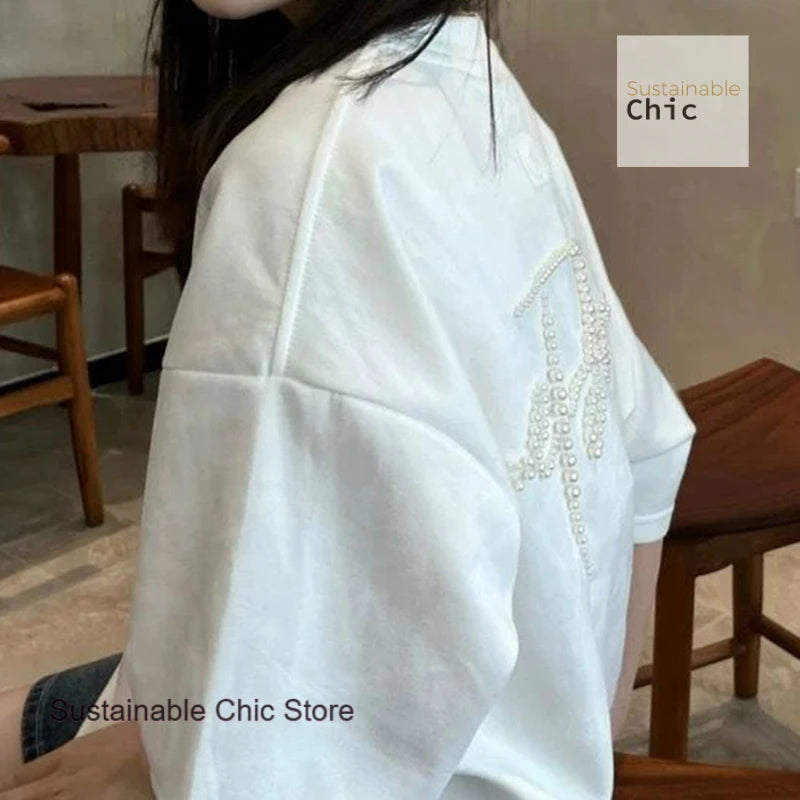 Korean version of fashion stereoscopic Pearl senior loose round neck T-shirt women's summer fashion and leisure niche design top
