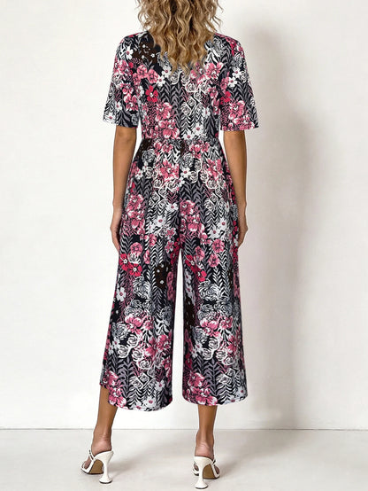 Women's Pink Floral Print Short Sleeve Jumpsuit, Summer Casual V Neck Elastic Waist Wide Leg Romper With Side Pockets