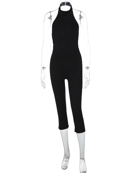 Hugcitar Ribbed Halter Backless Solid Button Sexy Bodycon Skinny Jumpsuit Summer Women Fashion Vacation Romper Streetwear Club