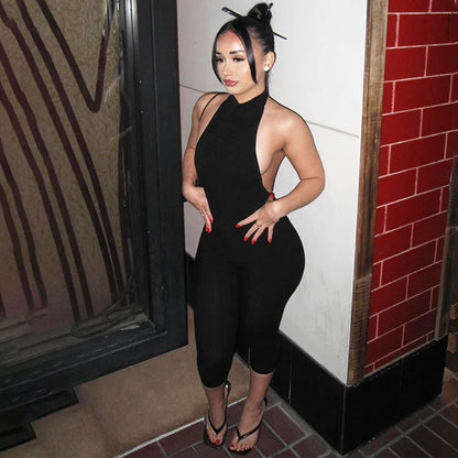 Hugcitar Ribbed Halter Backless Solid Button Sexy Bodycon Skinny Jumpsuit Summer Women Fashion Vacation Romper Streetwear Club