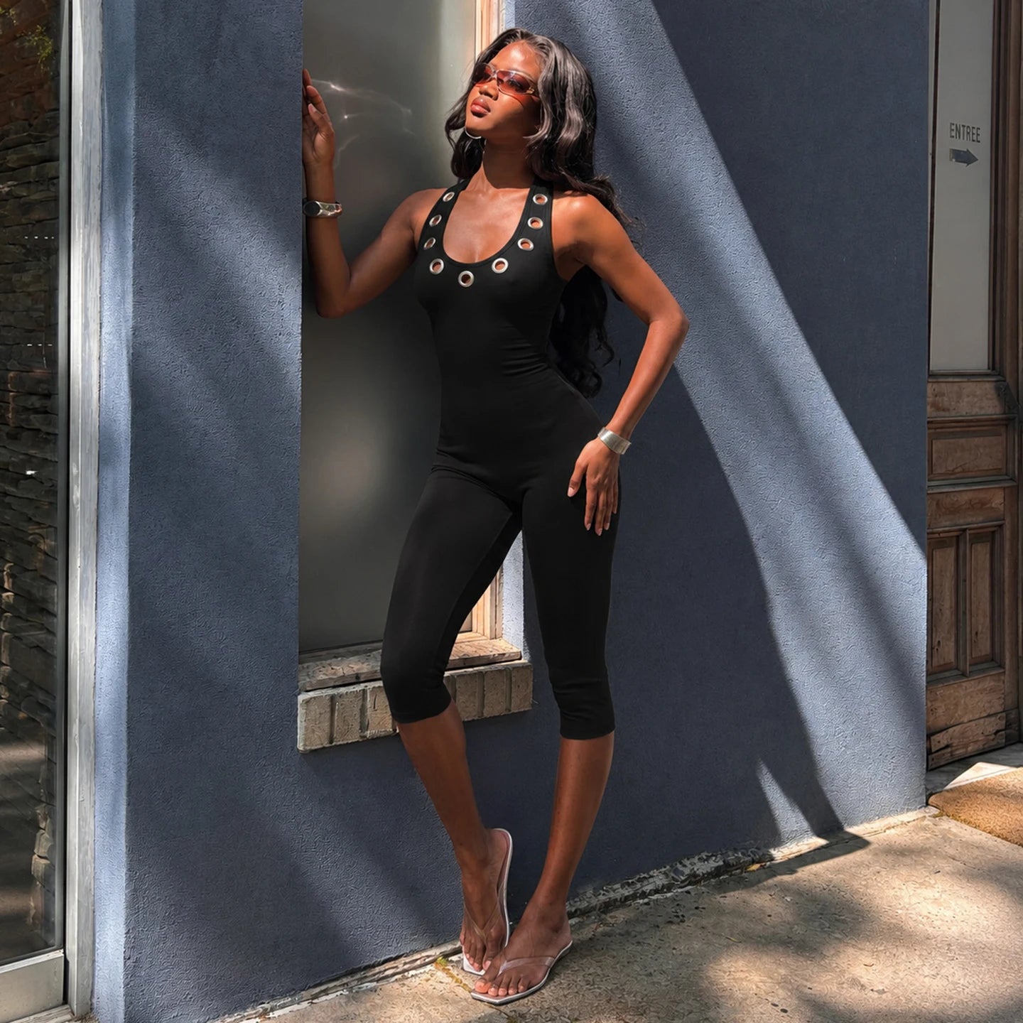 Women's Sleek Black Halter Jumpsuits With Eyelet Detailing Form-Fitting Capri Length Design Chic And Minimalist Summer Outfits