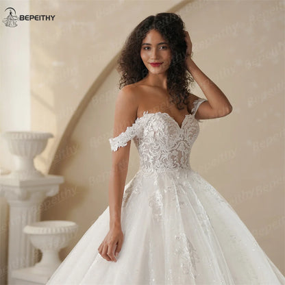 BEPEITHY Customized Princess Off Shoulder Sleeveless Ball Bride Wedding Dresses For Women 2025 Ivory Lace Glitter Bridal Gown