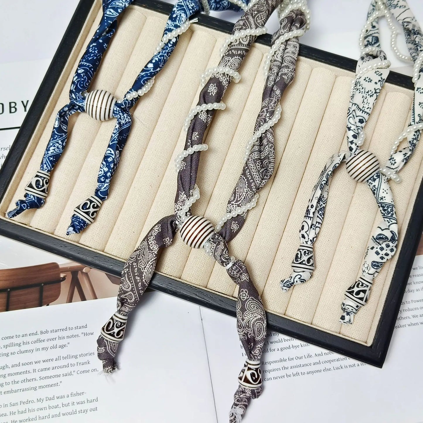 Cashew flower wrapped pearl scarf neck necklace for female artist, unique and beautiful hanging neck accessory, long sweater cha