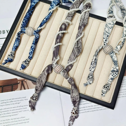 Cashew flower wrapped pearl scarf neck necklace for female artist, unique and beautiful hanging neck accessory, long sweater cha