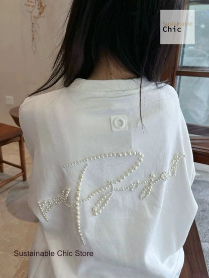 Korean version of fashion stereoscopic Pearl senior loose round neck T-shirt women's summer fashion and leisure niche design top