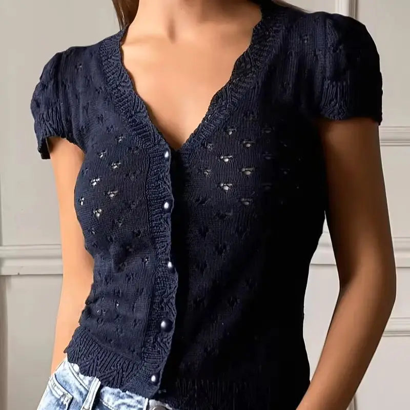 V-neck hollow-out short-sleeved knitted cardigan with single-breasted design, featuring a French vintage and gentle style short