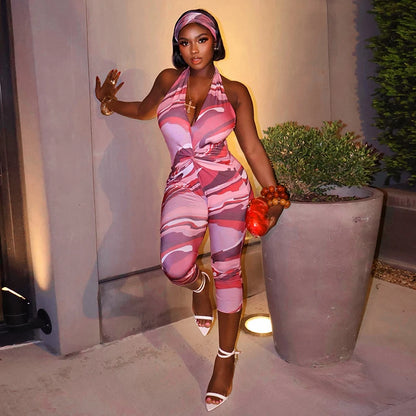 Two piece set of tight fitting seven part jumpsuit with deep V-neck print and headband