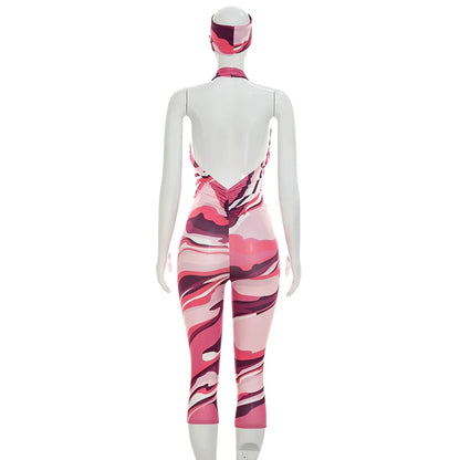 Two piece set of tight fitting seven part jumpsuit with deep V-neck print and headband